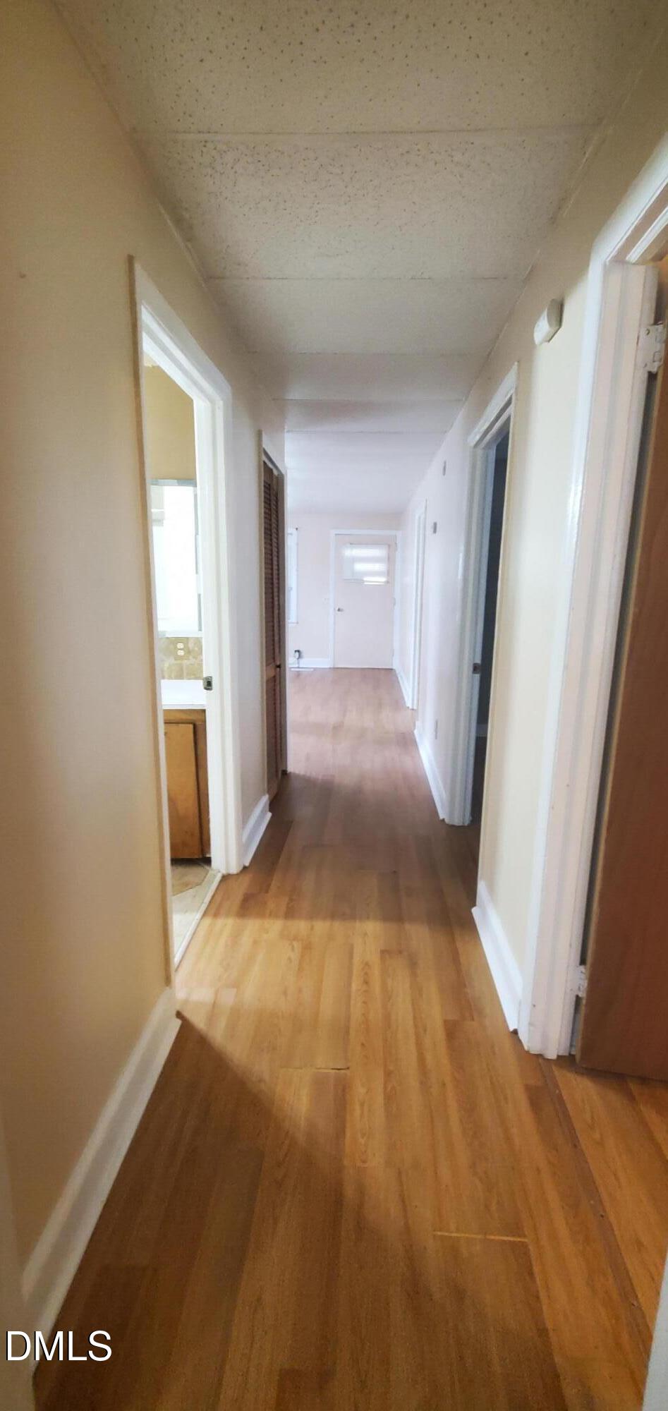 327 Ranch Farm Road Raleigh, NC 27603 - Photo 15 of 27 a view of hallway with wooden floor