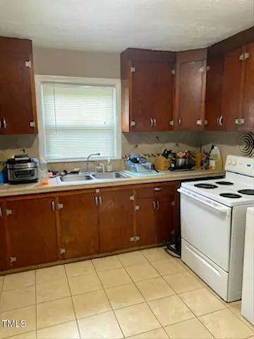 a room with a cabinets and a stove top oven