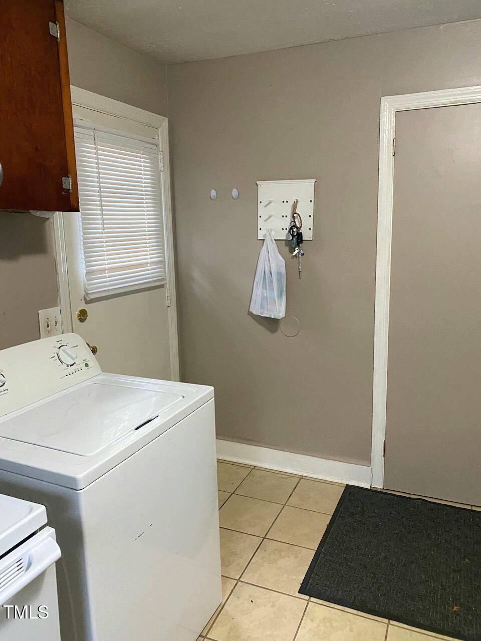 327 Ranch Farm Road Raleigh, NC 27603 - Photo 23 of 27 a utility room with dryer and washer