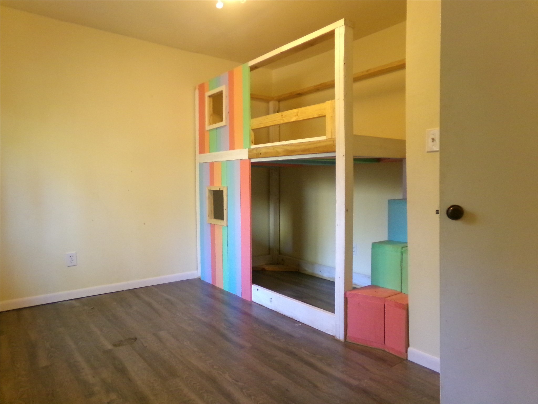 1380 Cardinal Lane Trinity, TX 75862 - Photo 12 of 12 an empty room with wooden floor and windows