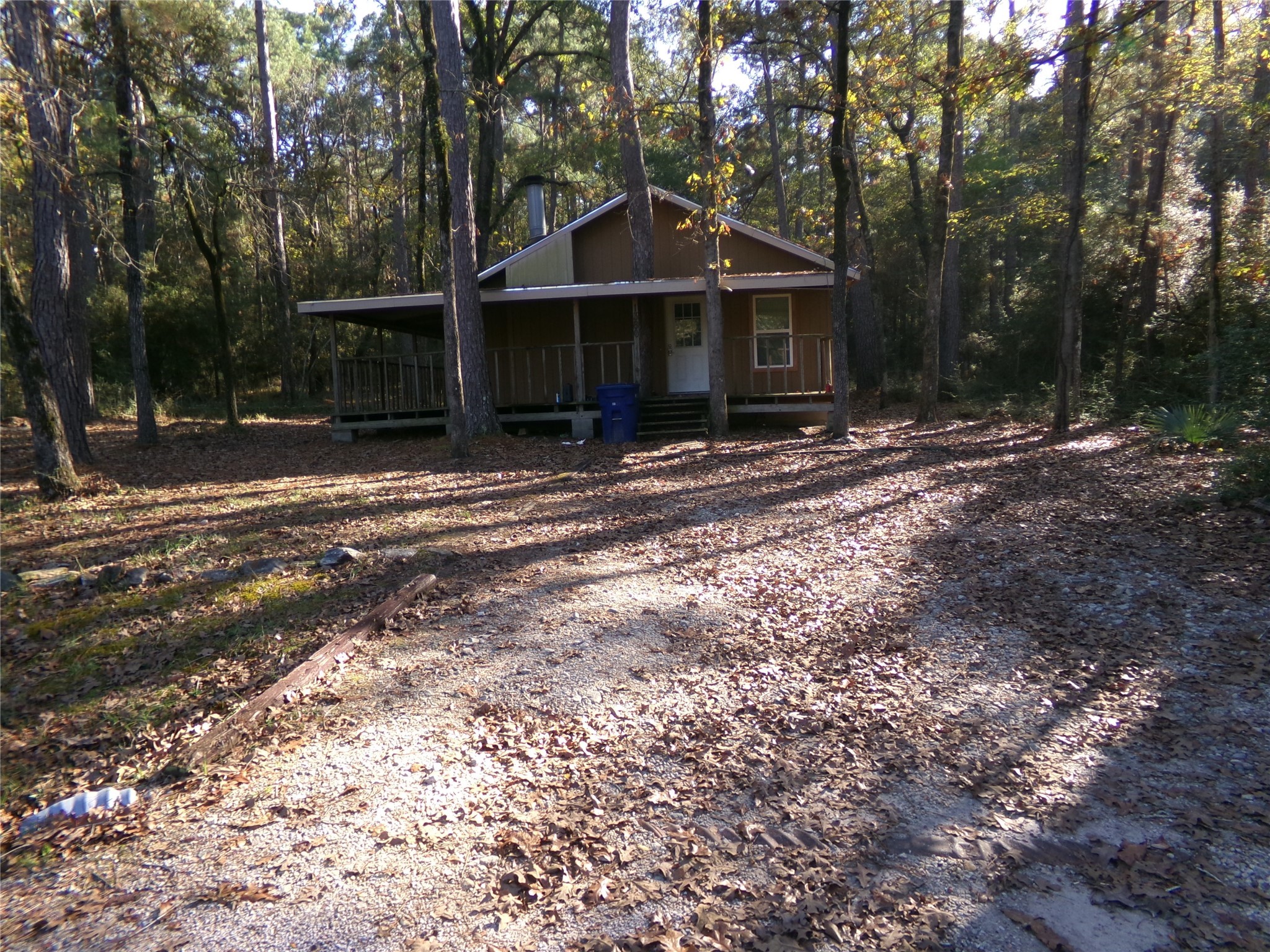 1380 Cardinal Lane Trinity, TX 75862 - Photo 2 of 12 a front view of a house with a yard