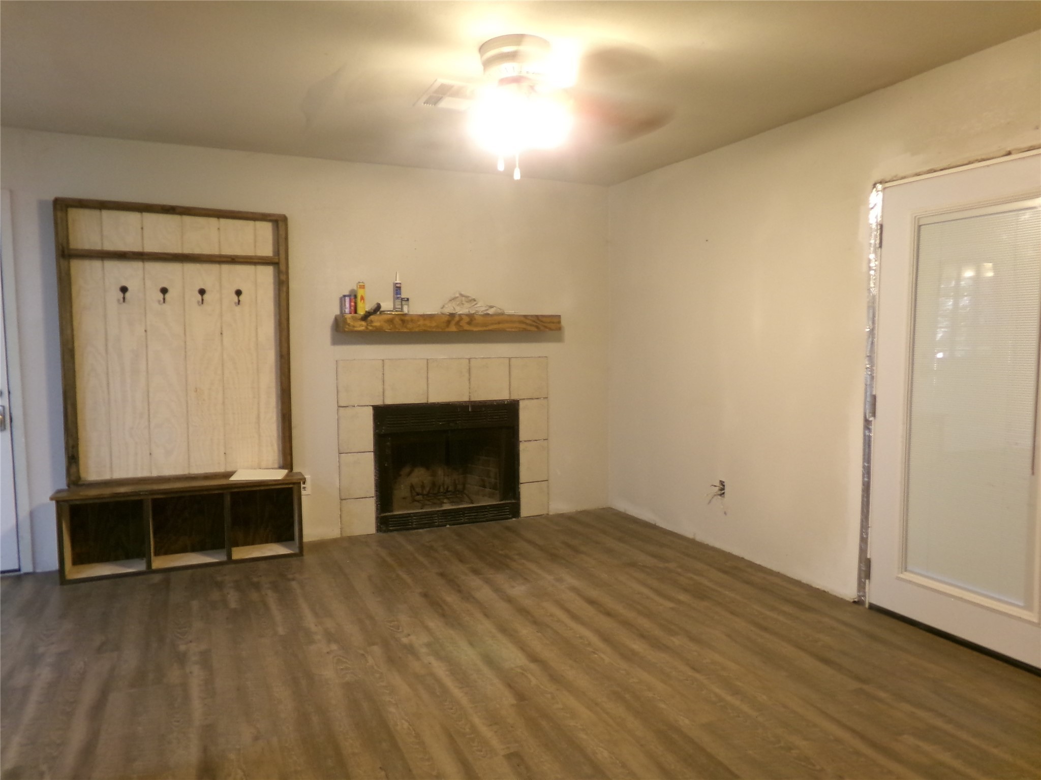 1380 Cardinal Lane Trinity, TX 75862 - Photo 6 of 12 a view of empty room with wooden floor and fireplace