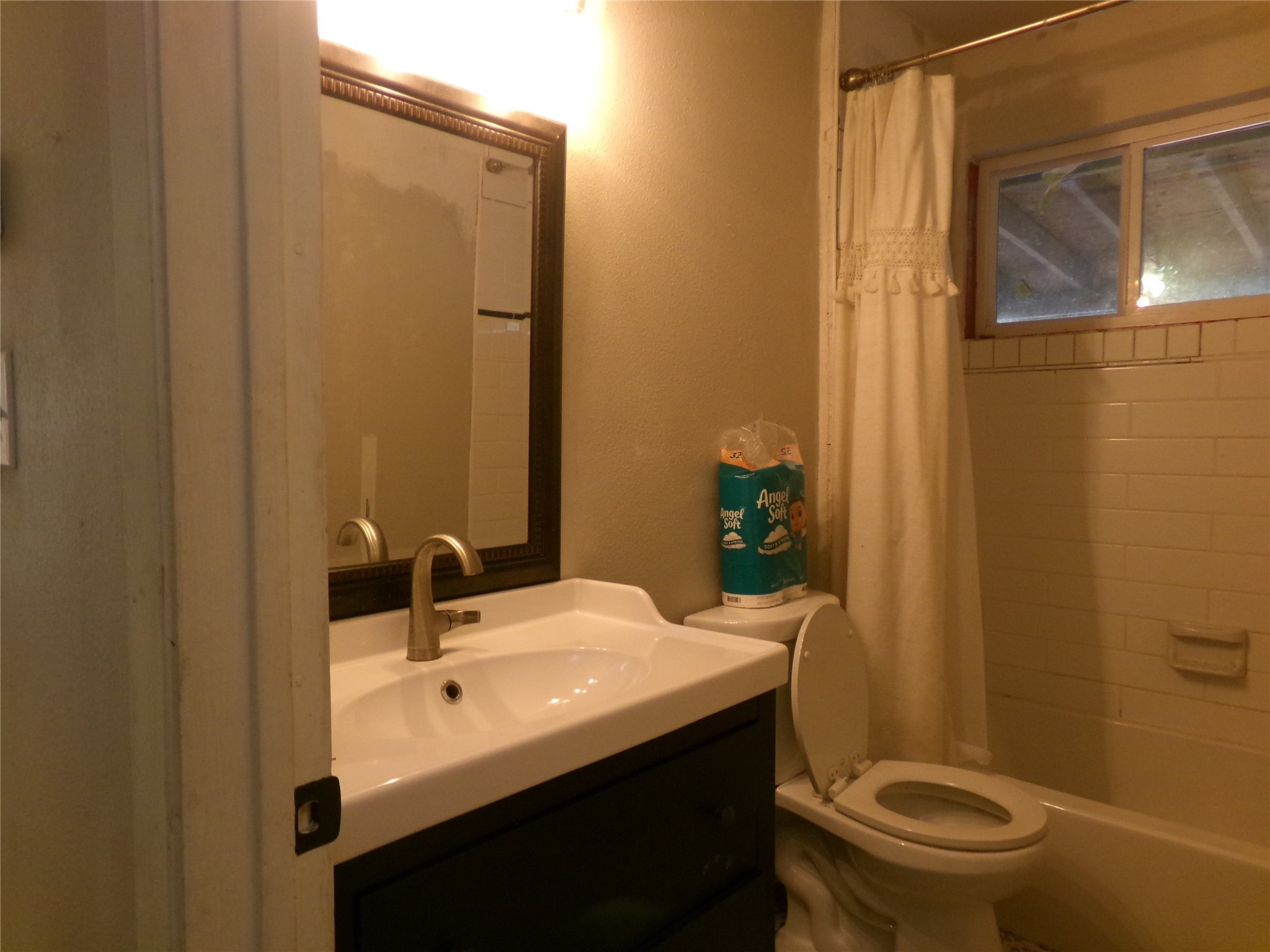 1380 Cardinal Lane Trinity, TX 75862 - Photo 7 of 12 a bathroom with a sink a toilet and shower