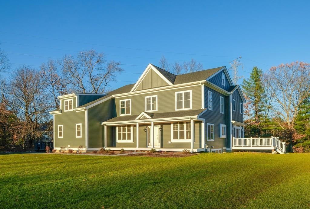 38 Michael Road Wayland, MA 01778 - Photo 1 of 27 a front view of a house with a yard