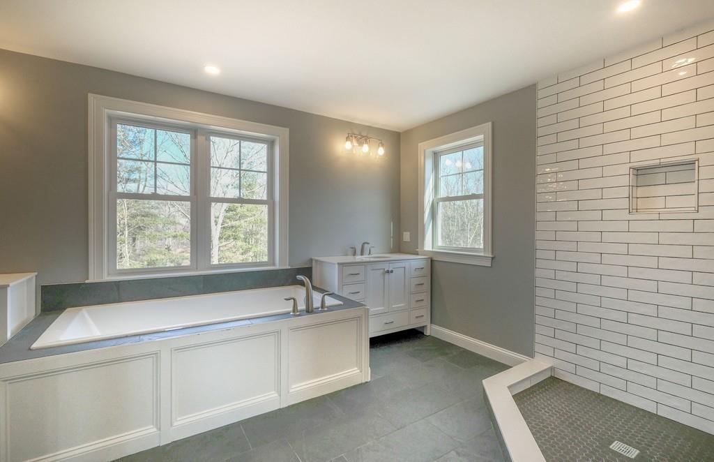 38 Michael Road Wayland, MA 01778 - Photo 15 of 27 a bathroom with a bathtub and a sink