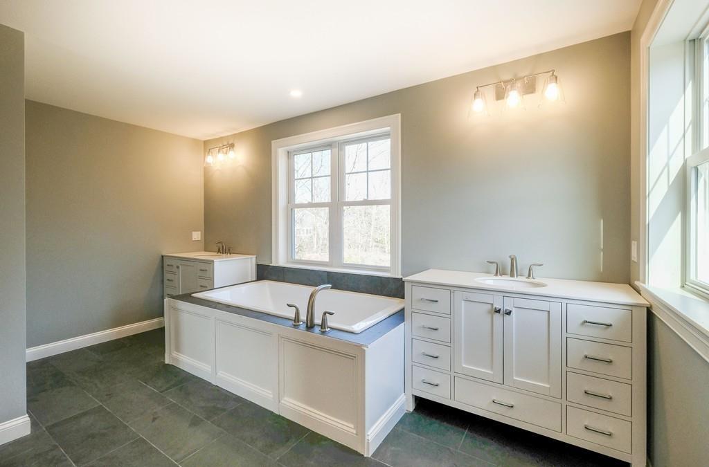 38 Michael Road Wayland, MA 01778 - Photo 16 of 27 a spacious bathroom with a tub sink and mirror