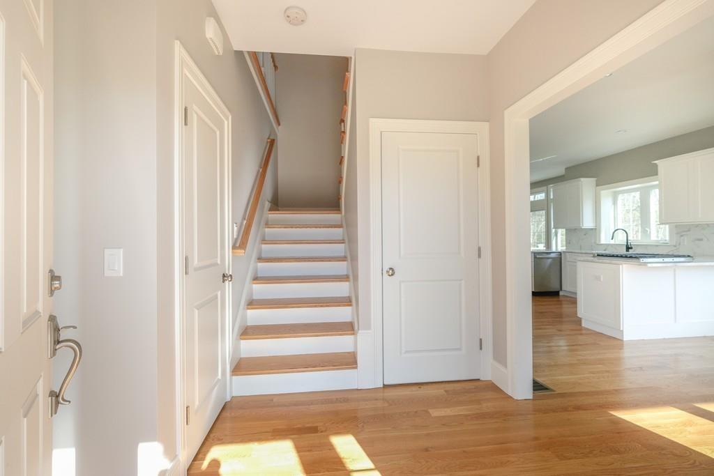38 Michael Road Wayland, MA 01778 - Photo 2 of 27 a view of a hallway view with wooden floor and kitchen view