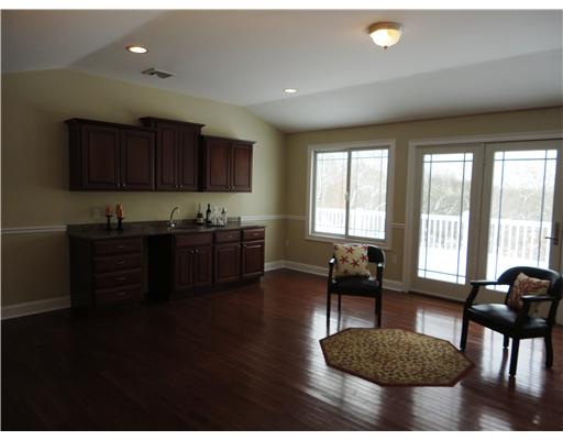 25 Ocean Ridge Drive Charlestown, RI 02813 - Photo 7 of 12 Den/Family/Great Room. Den with wetbar