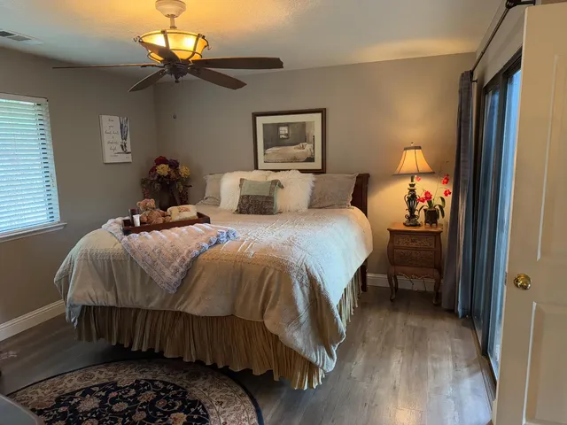 a living room with furniture and a mirror