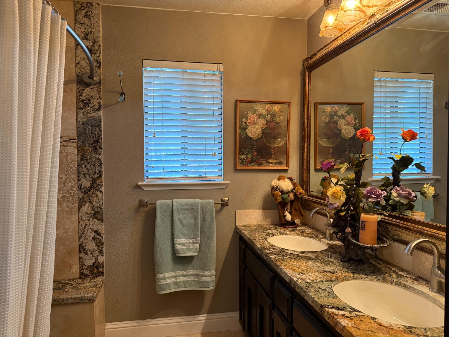 40820 Oak Ridge Drive Three Rivers, CA 93271 - Photo 20 of 47 a bathroom with a granite countertop sink a mirror and shower