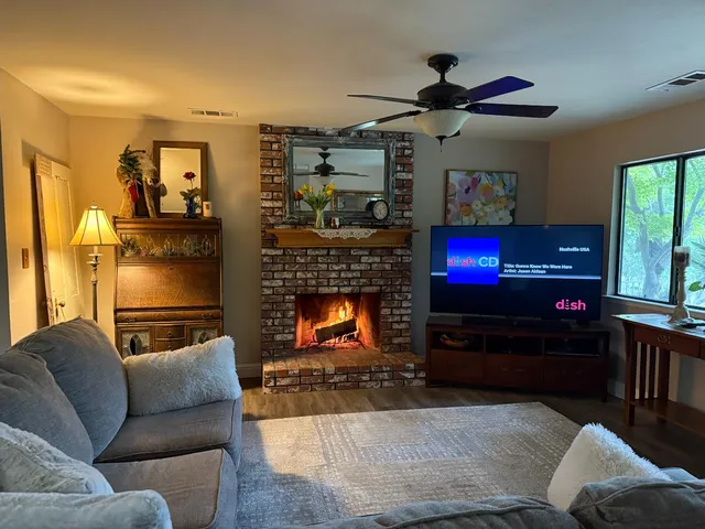a view of a living room filled with furniture