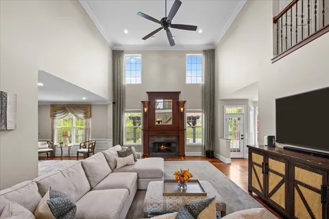 a living room with fireplace furniture and a flat screen tv