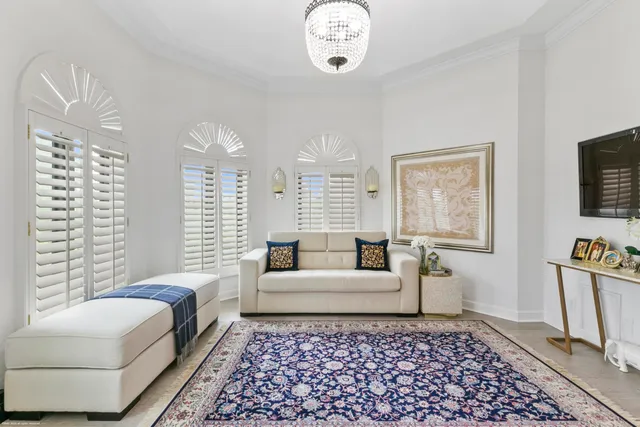 a living room with furniture and a rug