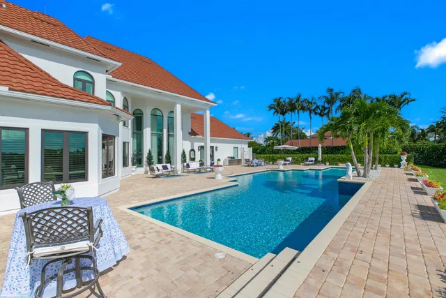 a view of swimming pool with chairs