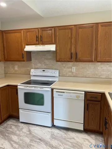 a kitchen with a stove and a sink