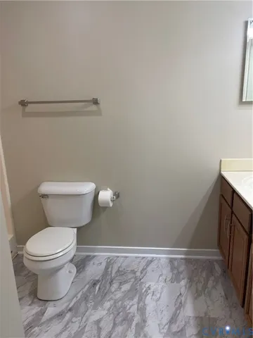 a bathroom with a toilet and a sink