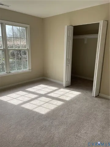 an empty room with a empty space and a window