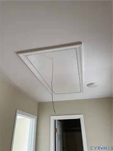 a view of room with window and entryway