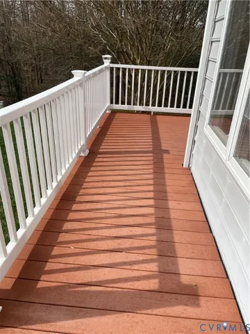 a balcony with wooden floor