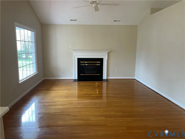 wooden floor fireplace and natural light