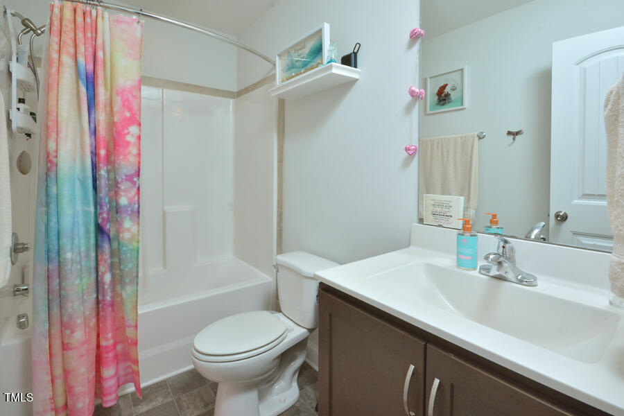 195 Timberwind Road Franklinton, NC 27525 - Photo 16 of 28 a bathroom with a sink toilet and shower