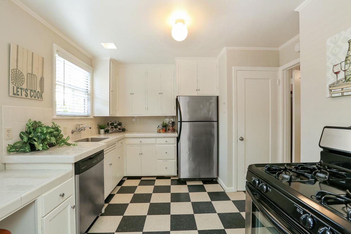 3 Victoria Road Burlingame, CA 94010 - Photo 14 of 31 a kitchen with a stove a refrigerator and a sink