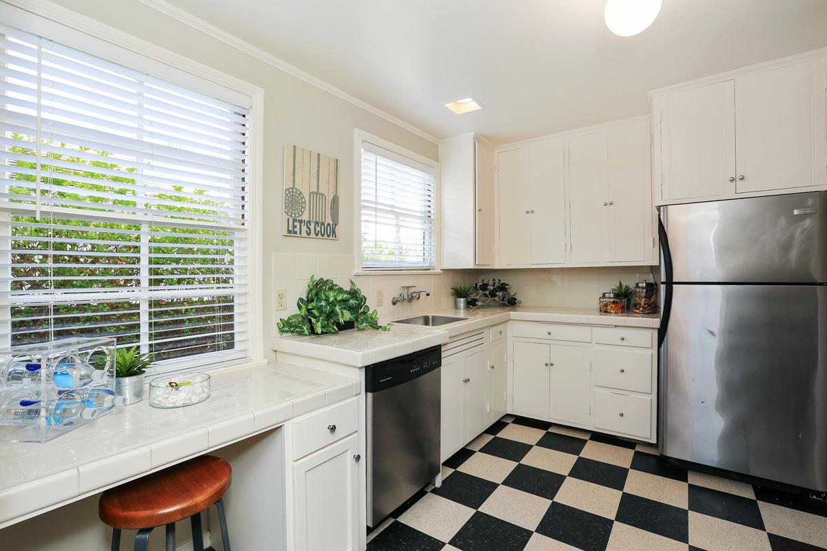 3 Victoria Road Burlingame, CA 94010 - Photo 15 of 31 a kitchen with a sink stove and cabinets