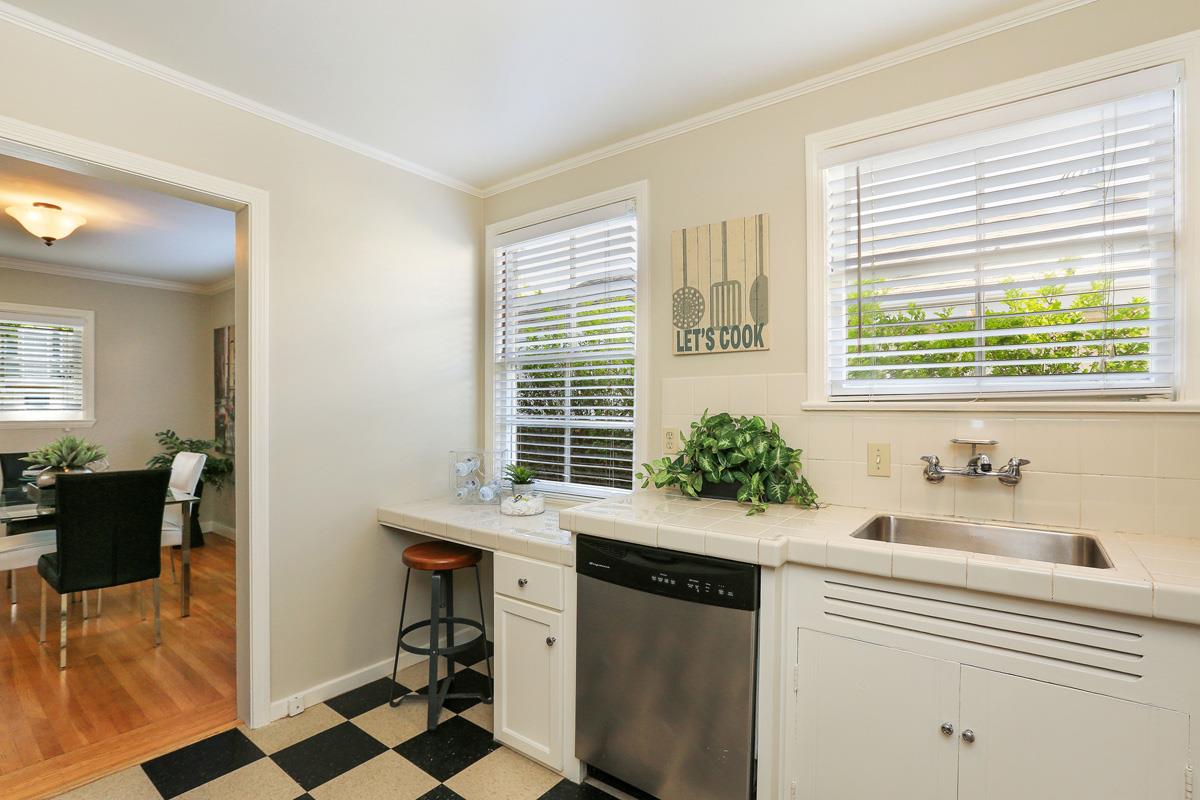 3 Victoria Road Burlingame, CA 94010 - Photo 16 of 31 a kitchen with a sink and cabinets