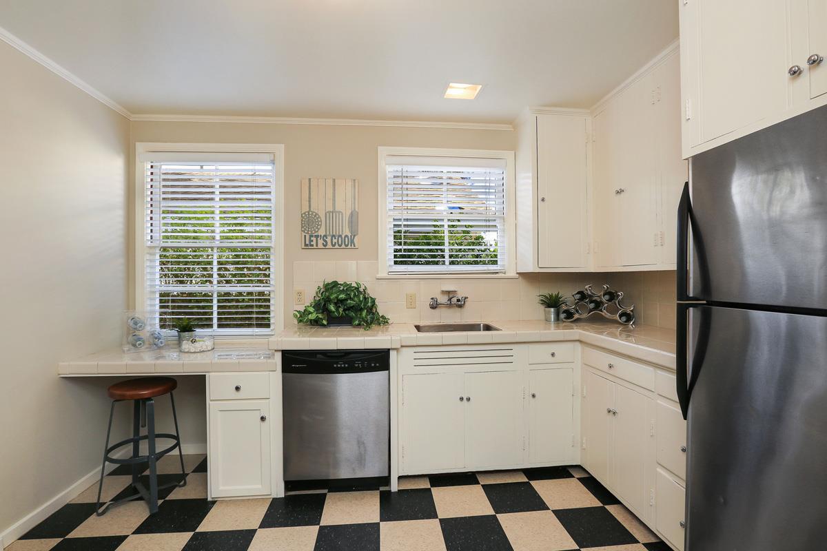 3 Victoria Road Burlingame, CA 94010 - Photo 17 of 31 a kitchen with a refrigerator a sink and a window