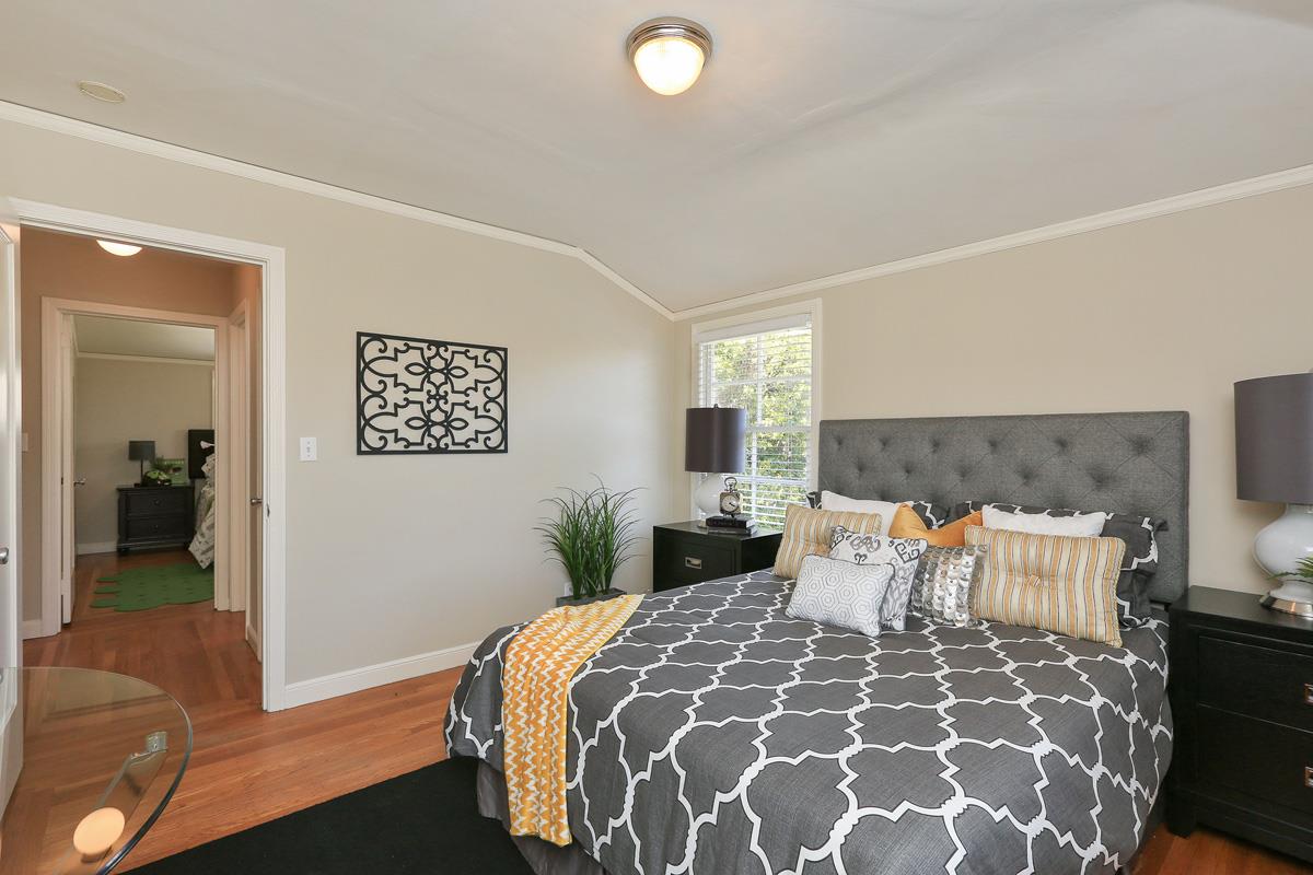 3 Victoria Road Burlingame, CA 94010 - Photo 19 of 31 a bedroom with a large bed and a chandelier