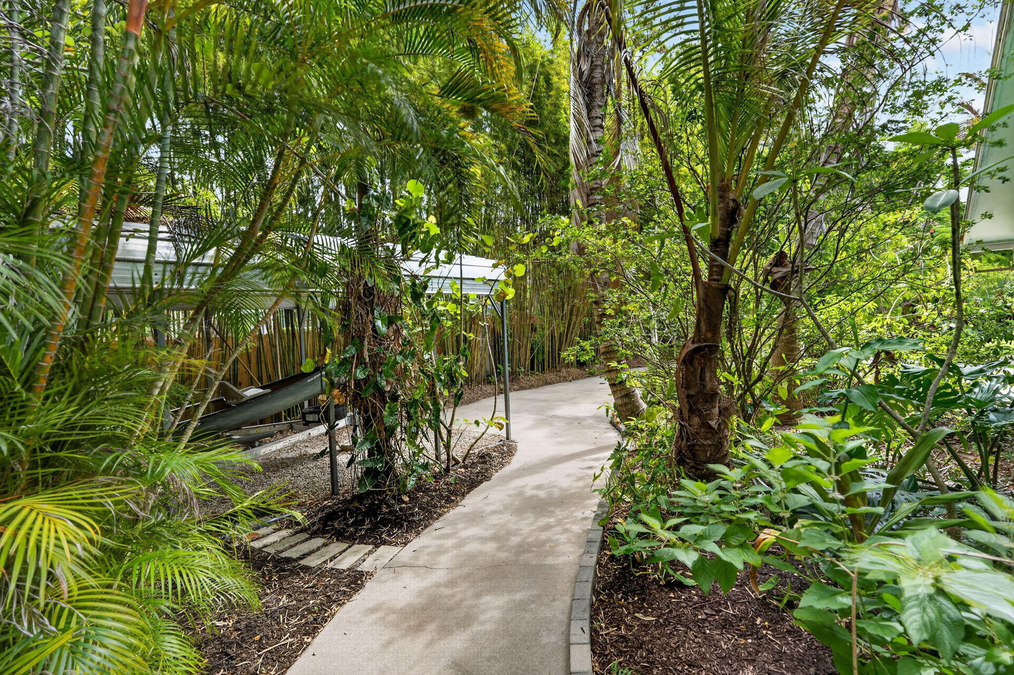 17391 Alexander Run Jupiter, FL 33478 - Photo 48 of 55 a pathway of a yard