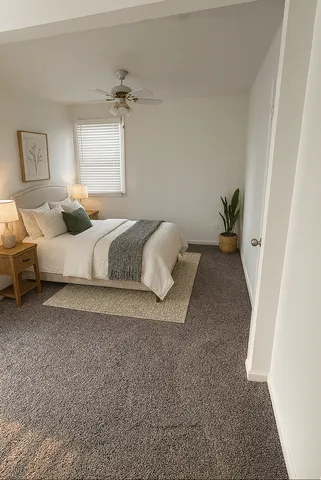 a spacious bedroom with a bed and a window
