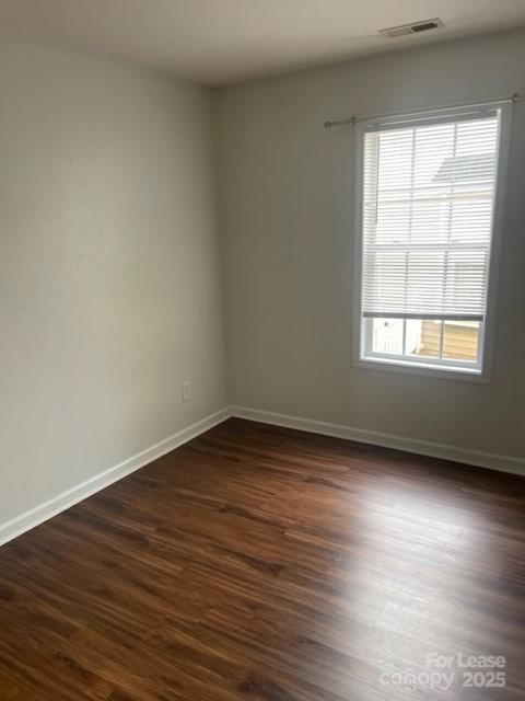 2012 Kansas City Drive Monroe, NC 28110 - Photo 10 of 14 an empty room with wooden floor and windows