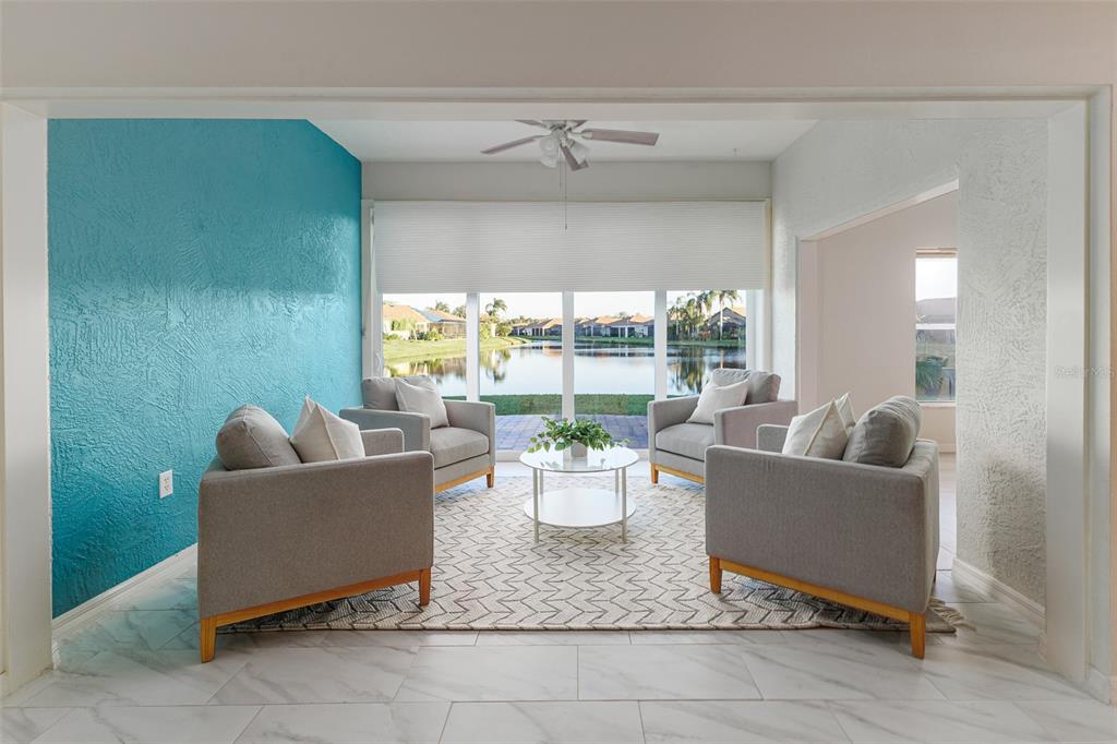 4188 Muirfield Loop Lake Wales, FL 33859 - Photo 3 of 74 a living room with furniture and a potted plant