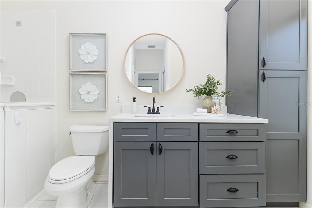4188 Muirfield Loop Lake Wales, FL 33859 - Photo 42 of 74 a bathroom with a toilet a sink and mirror