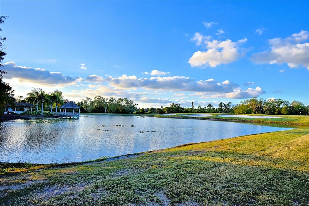 4188 Muirfield Loop Lake Wales, FL 33859 - Photo 53 of 74 a view of a lake with houses in the back