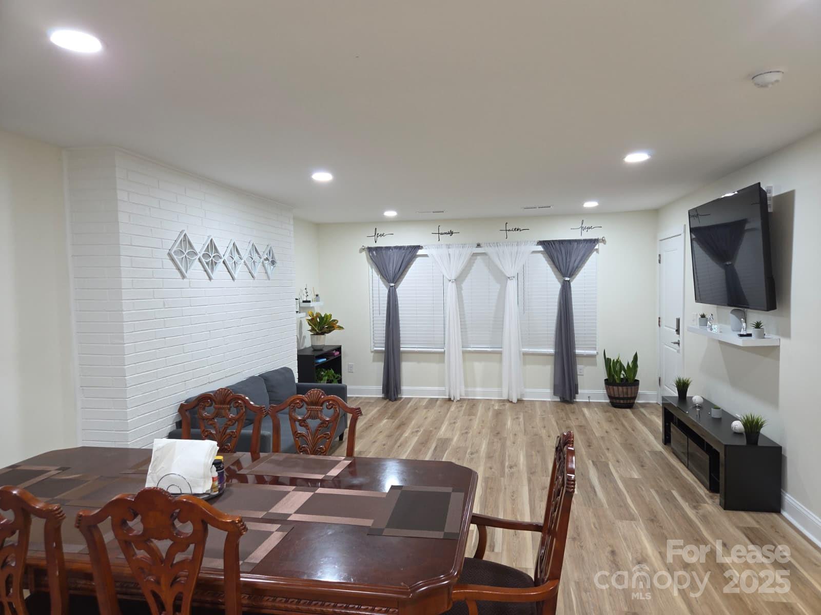 4265 Franklin Community Center Road Salisbury, NC 28144 - Photo 4 of 9 a living room with furniture and a flat screen tv