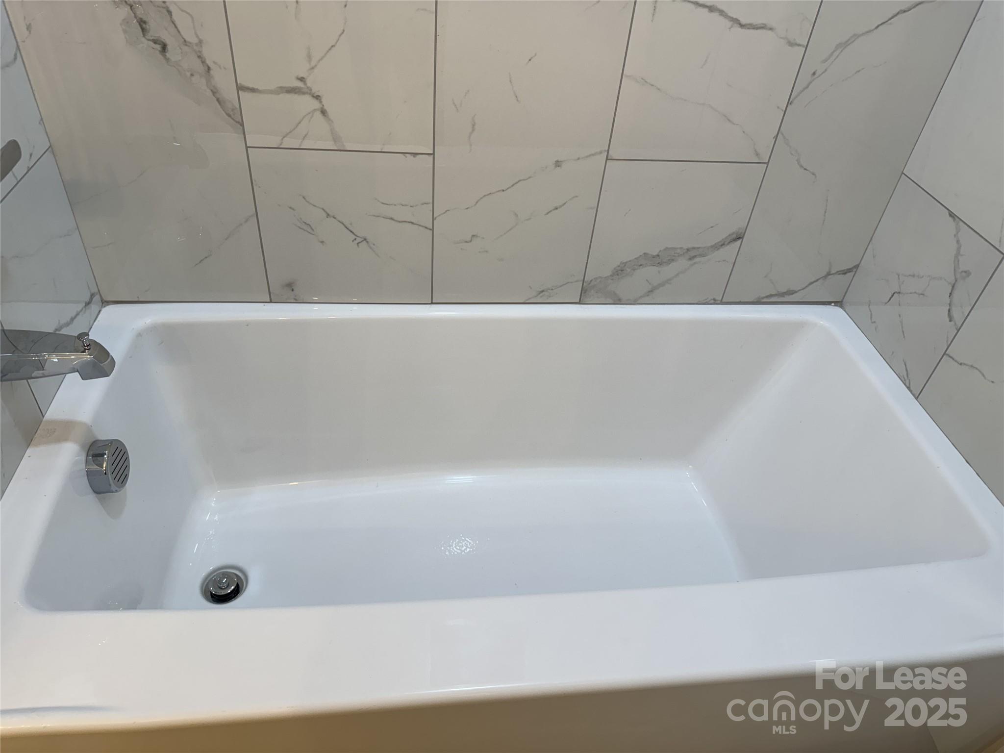 4265 Franklin Community Center Road Salisbury, NC 28144 - Photo 7 of 9 a bathroom with a bathtub