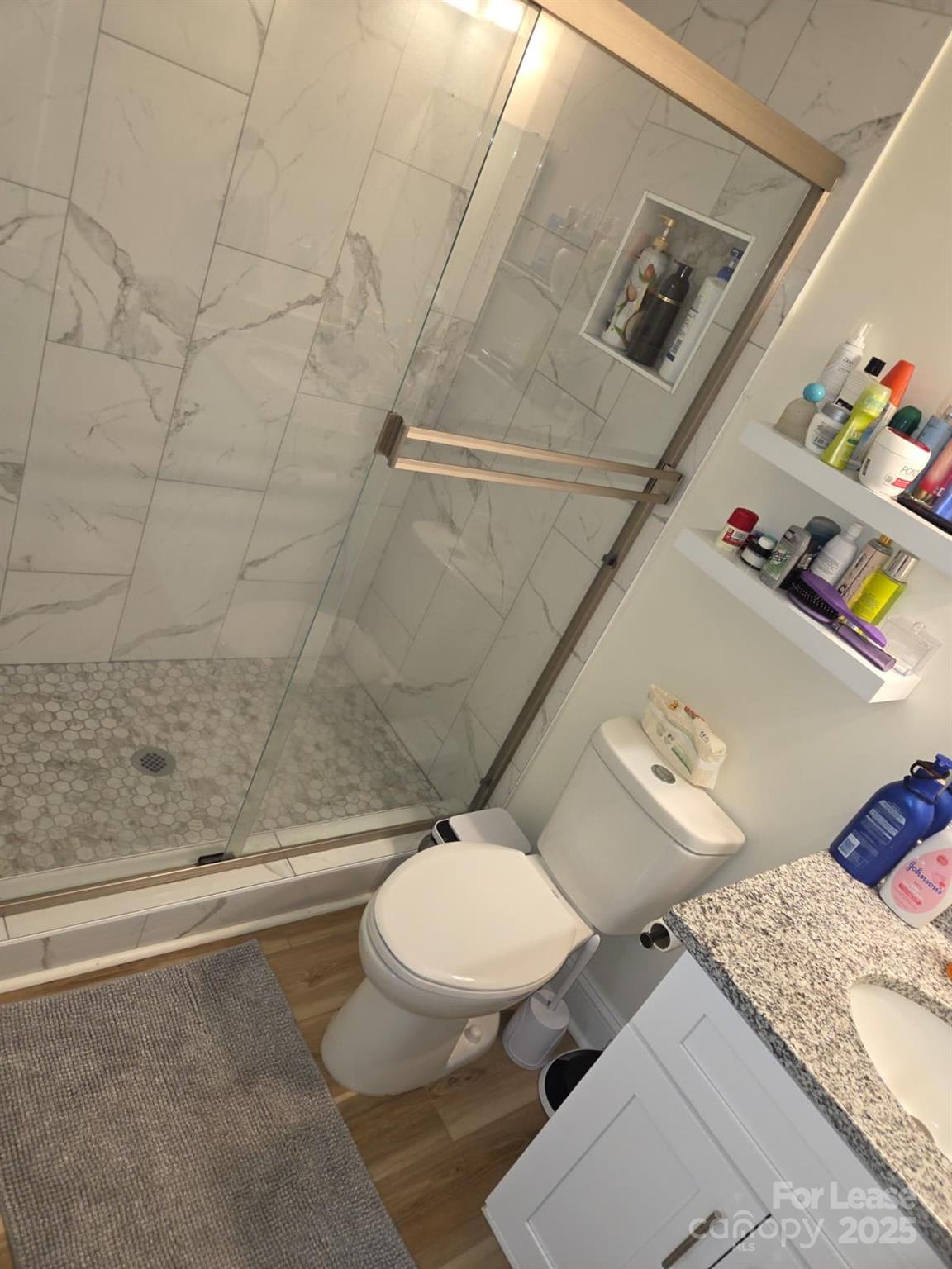 4265 Franklin Community Center Road Salisbury, NC 28144 - Photo 9 of 9 a bathroom with a sink mirror vanity and toilet