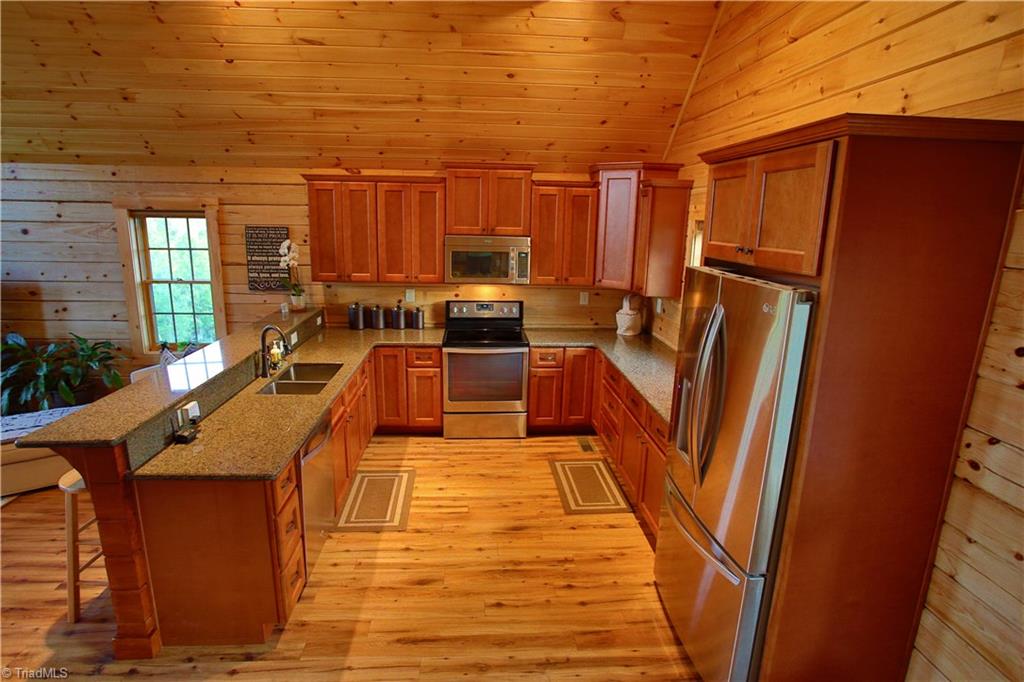 224 Bennett Road Stoneville, NC 27048 - Photo 10 of 27 Stylish Kitchen with granite cts and soft close drawers on the custom cabinets!