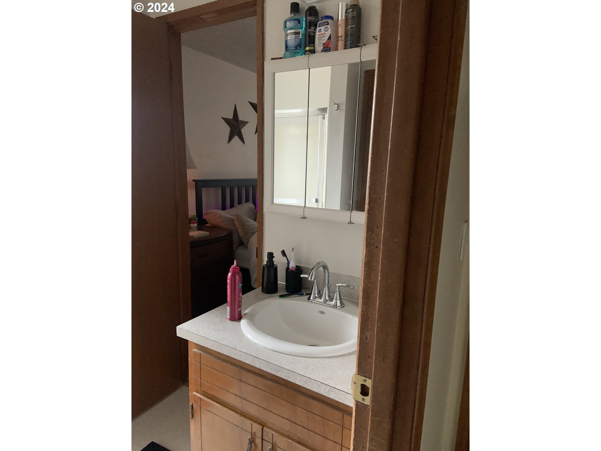 6757 Main Street Springfield, OR 97478 - Photo 11 of 22 a bathroom with a sink and a mirror