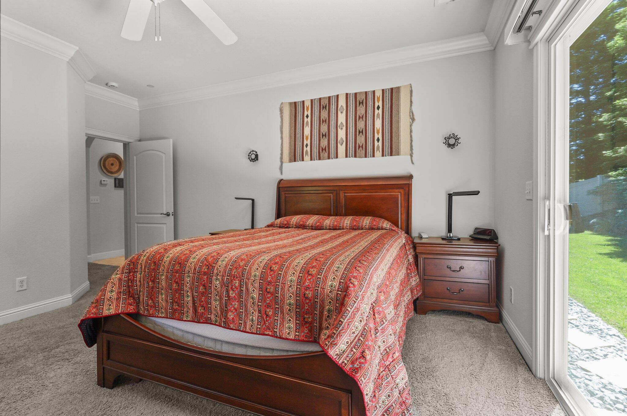 955 Leisha Lane Redding, CA 96001 - Photo 12 of 36 a bedroom with a large bed and a window