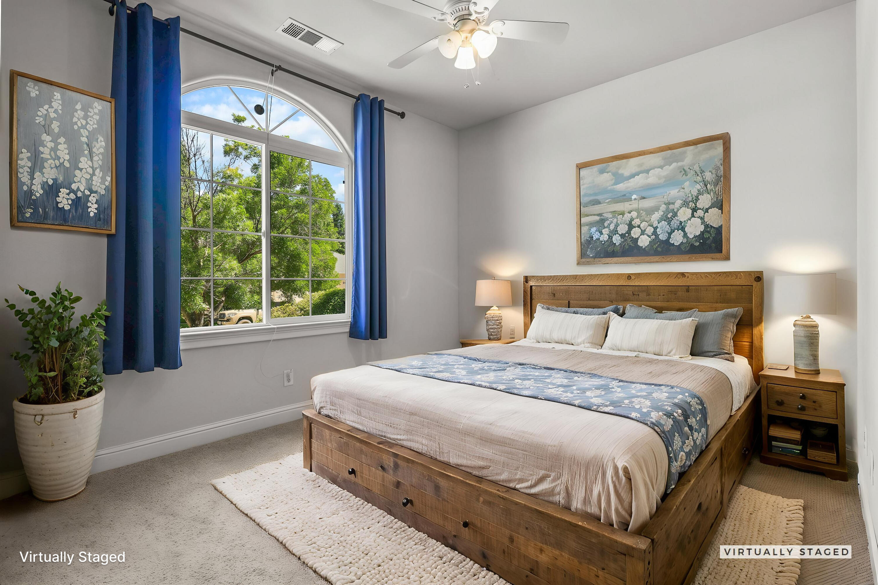 955 Leisha Lane Redding, CA 96001 - Photo 16 of 36 a bedroom with a large bed and a potted plant