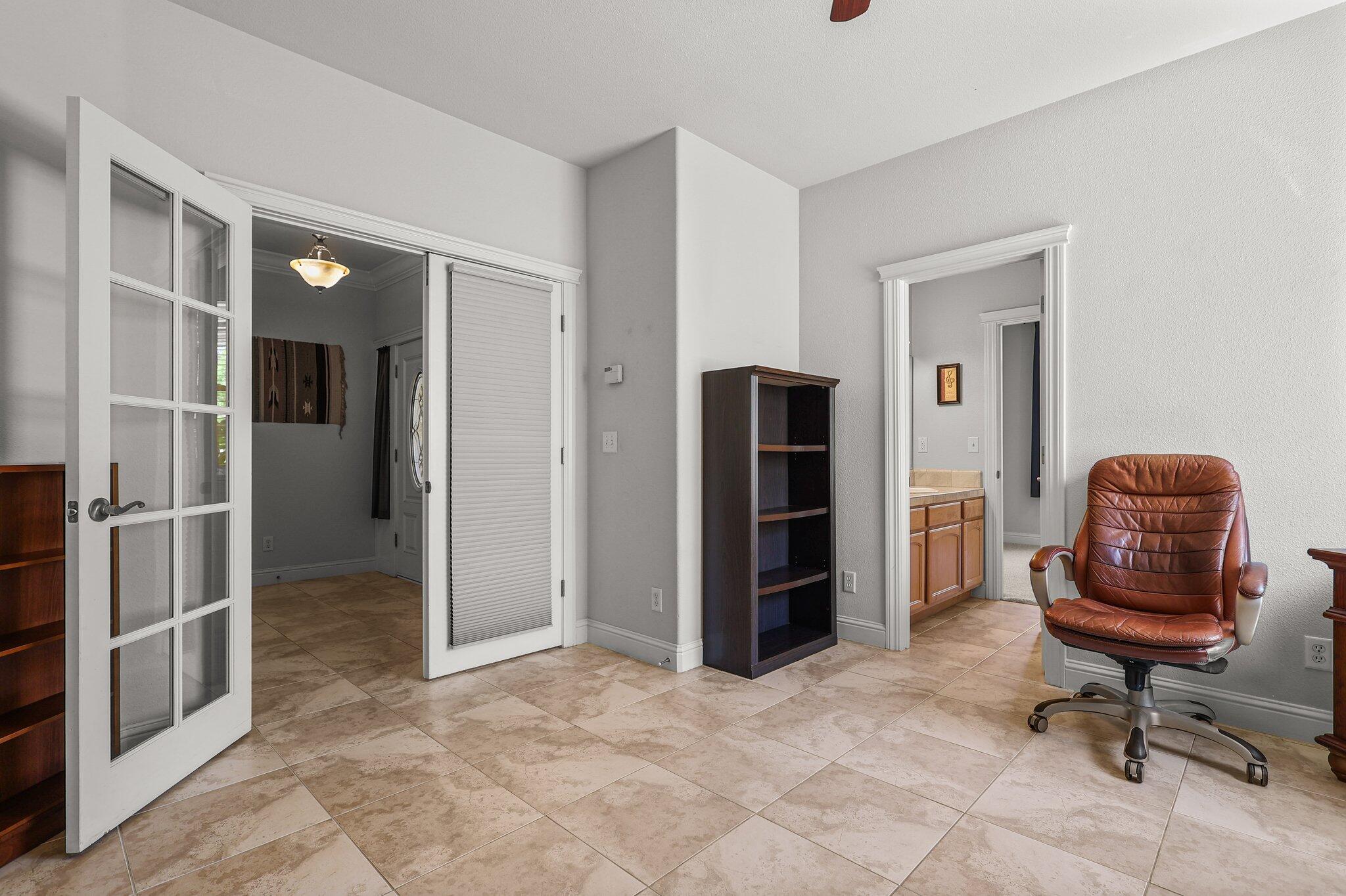 955 Leisha Lane Redding, CA 96001 - Photo 21 of 36 a view of a hallway with workspace and a window