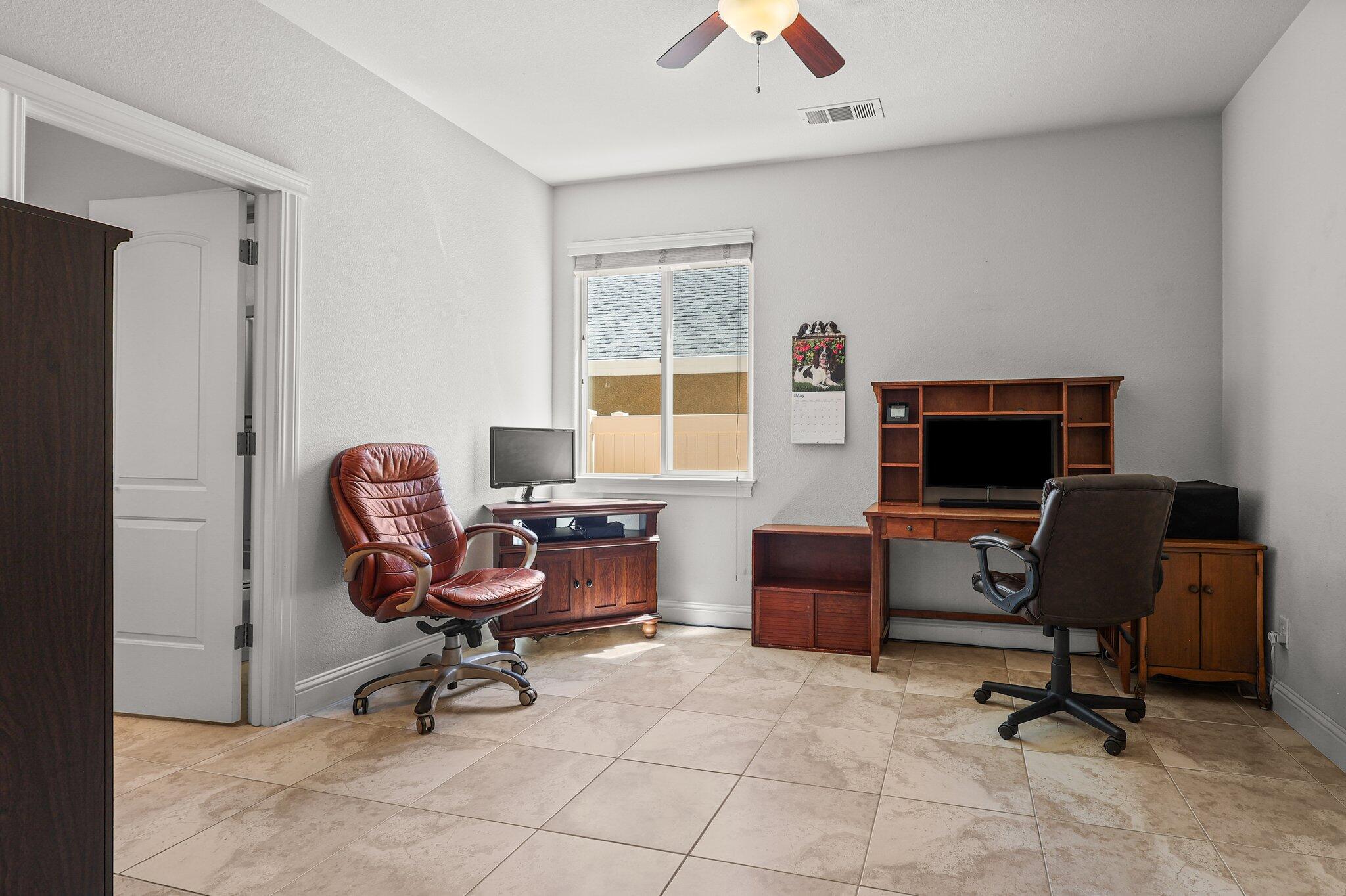 955 Leisha Lane Redding, CA 96001 - Photo 22 of 36 a view of a workspace with furniture and a window