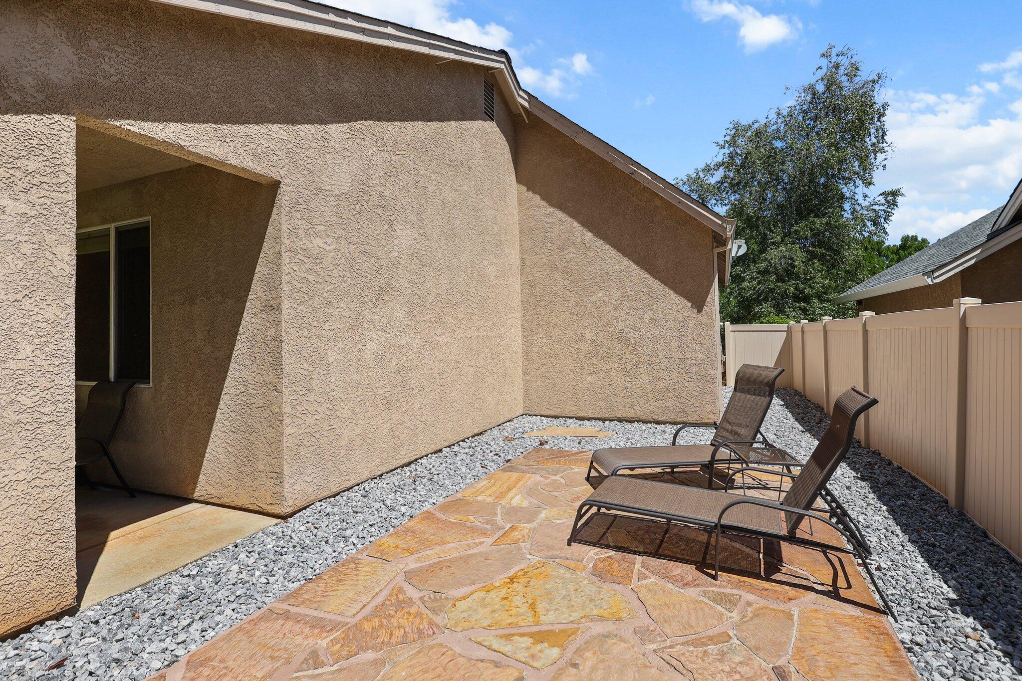 955 Leisha Lane Redding, CA 96001 - Photo 28 of 36 a backyard of a house with table and chairs