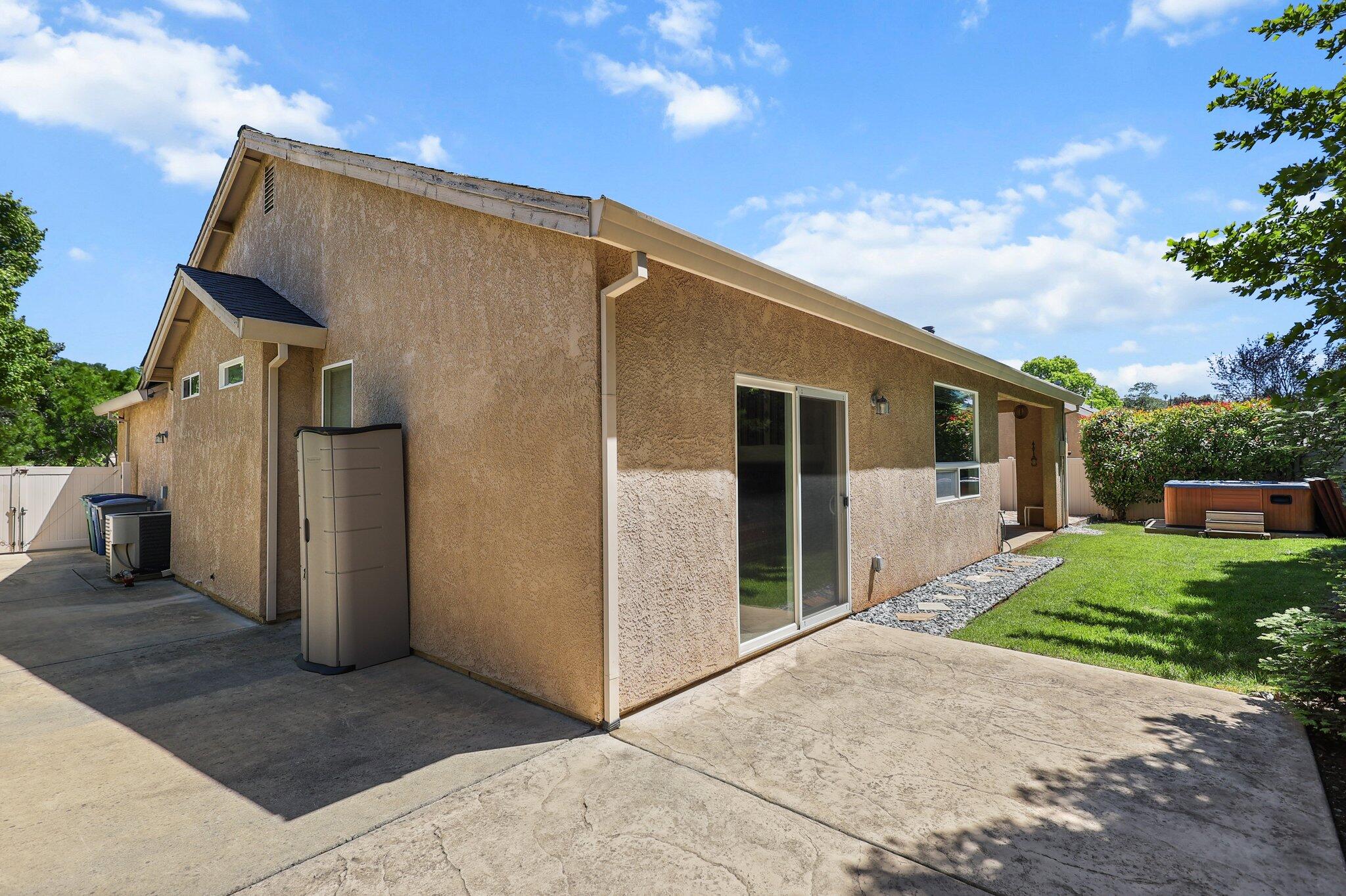 955 Leisha Lane Redding, CA 96001 - Photo 29 of 36 a view of a house with backyard and a tree