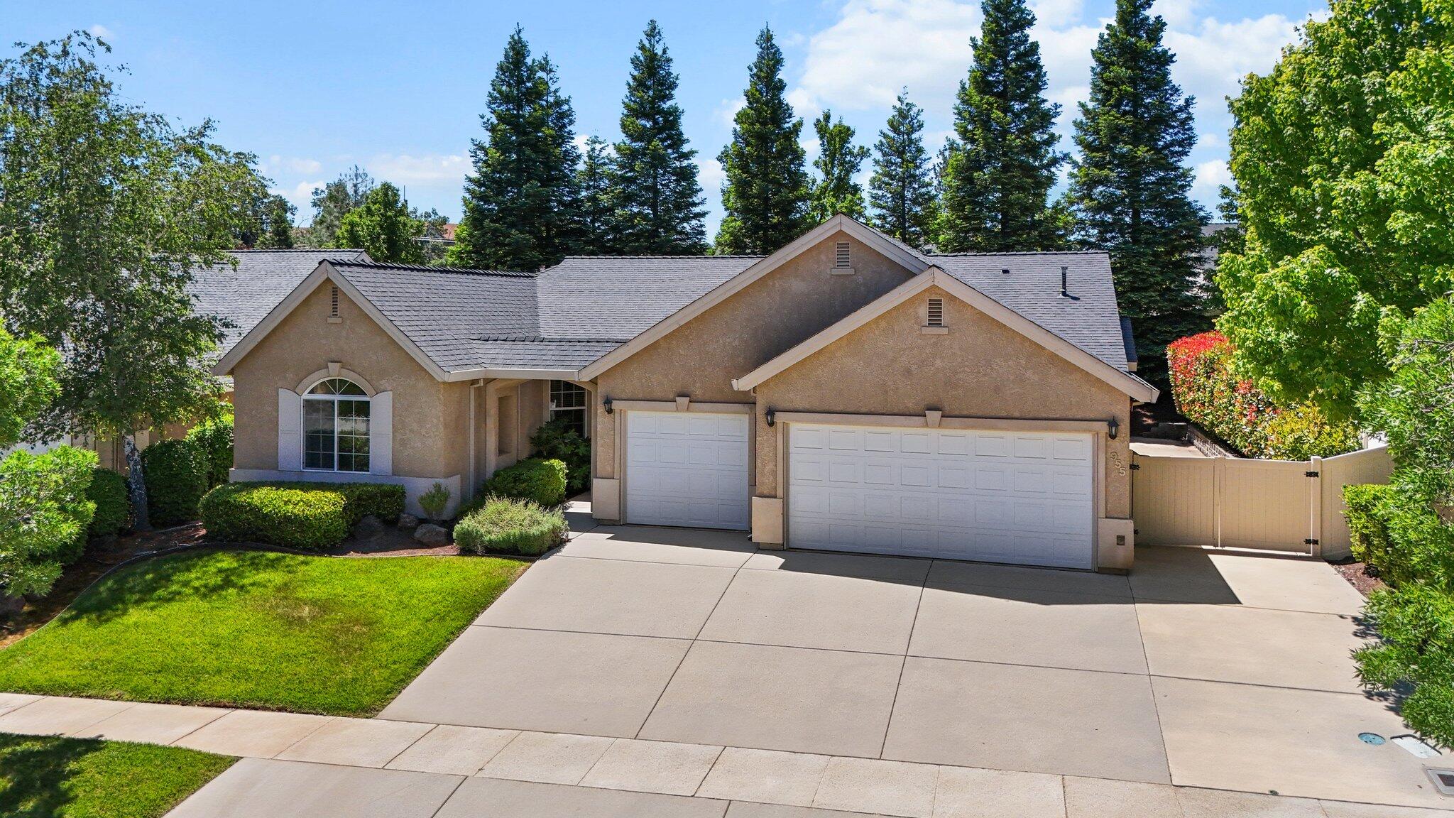 955 Leisha Lane Redding, CA 96001 - Photo 34 of 36 a view of a house with a yard and large tree