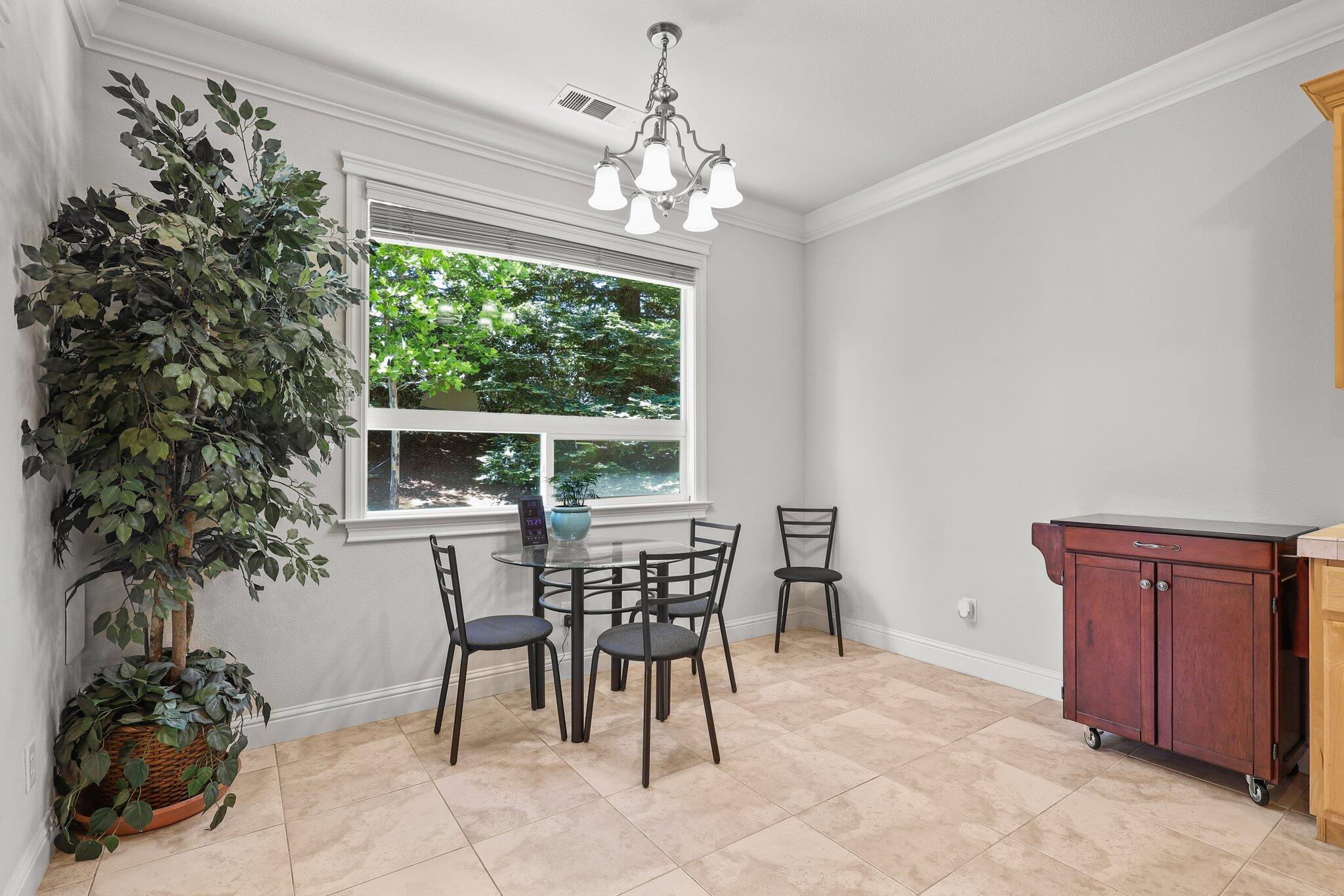955 Leisha Lane Redding, CA 96001 - Photo 7 of 36 a view of a dining room with furniture window and outside view
