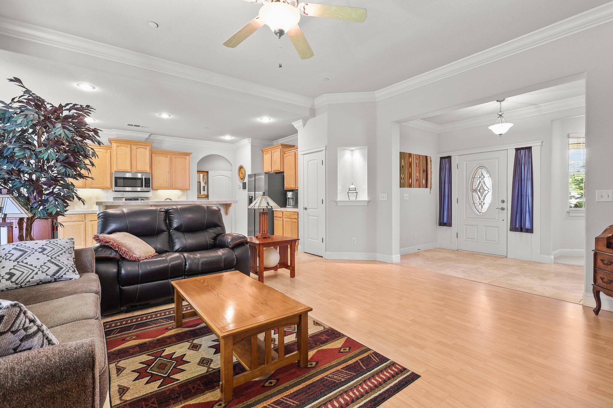 955 Leisha Lane Redding, CA 96001 - Photo 9 of 36 a living room with furniture and a chandelier